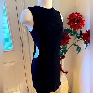 Black Sleeveless Bodycon Dress with chic cut out.